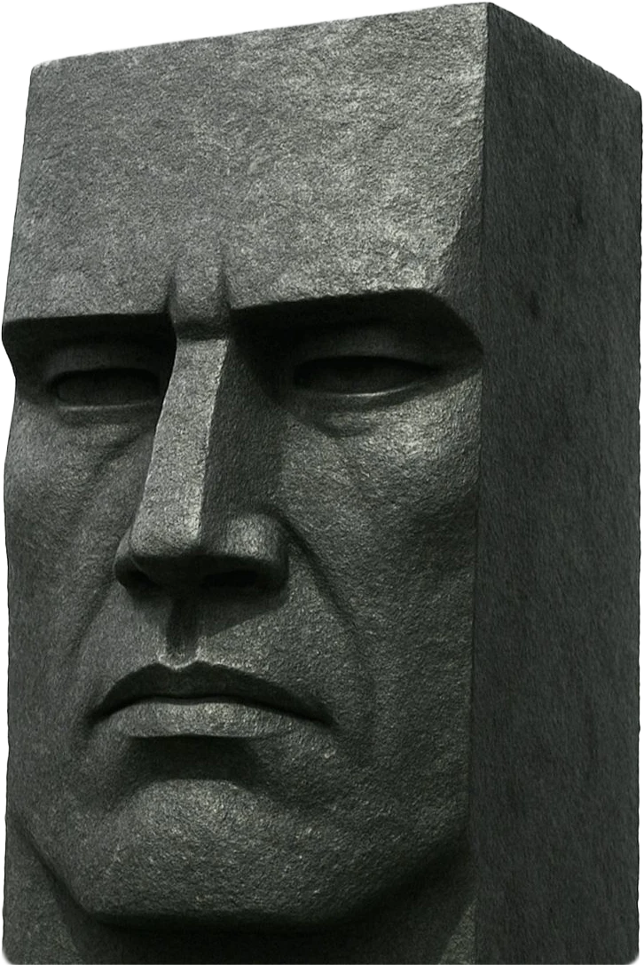 Carved granite head with a stern, square-cut face
